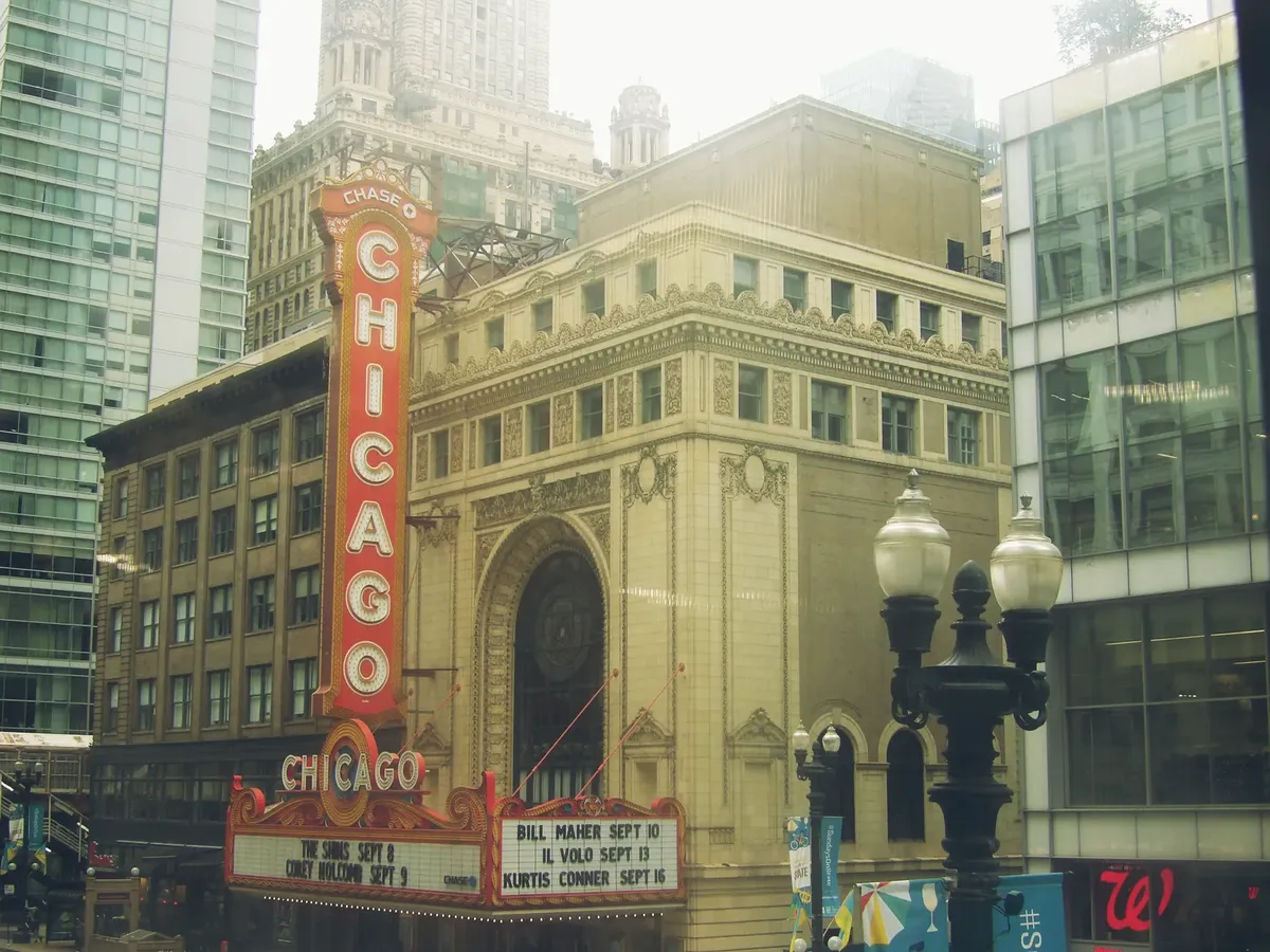 Chicago Theatre marquee in downtown, showcasing architectural beauty and urban life.