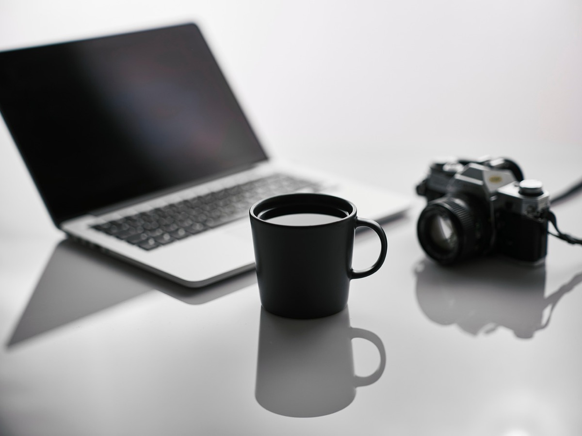 YouTuber with camera and laptop